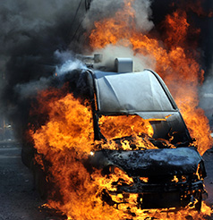 a van on the street explodes in flames